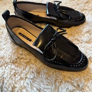 Zara Black Flats with Glossy Finish and Tassel Detail